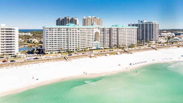 bird's eye view featuring a view of city, a beach view, and a water view