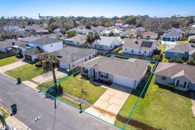 birds eye view of property with a residential view