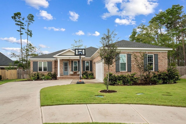 view of front of property featuring brick siding, a front lawn, an attached garage, and fence