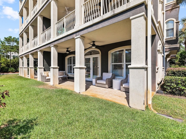 exterior space featuring a balcony and ceiling fan