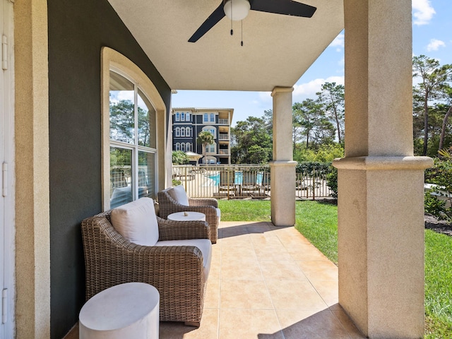 view of patio / terrace featuring fence and a ceiling fan