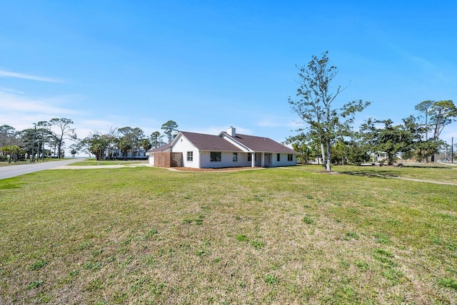 view of front of home with a front yard