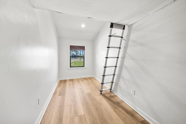 empty room featuring light wood finished floors and baseboards