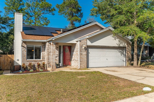 single story home with a chimney, concrete driveway, fence, a garage, and a front lawn