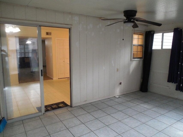 unfurnished room with a ceiling fan and visible vents