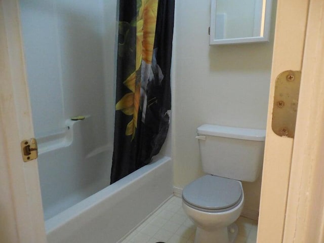 full bathroom featuring toilet and tile patterned floors