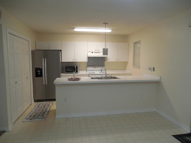 946 Ashley Ln Unit C, Fort Walton Beach, FL 32547 - kitchen featuring stainless steel appliances, a sink, light floors, and light countertops