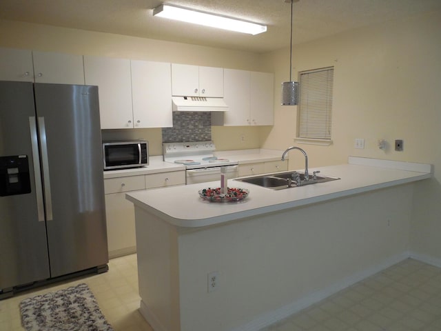 946 Ashley Ln Unit C, Fort Walton Beach, FL 32547 - kitchen with appliances with stainless steel finishes, a sink, premium range hood, light floors, and a peninsula