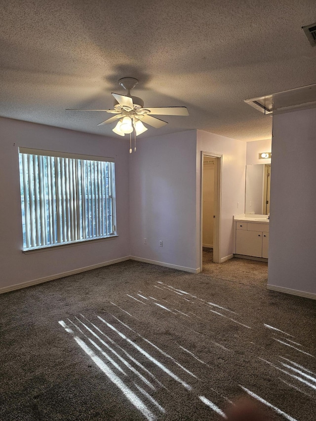946 Ashley Ln Unit C, Fort Walton Beach, FL 32547 - unfurnished room with attic access, carpet, a ceiling fan, a textured ceiling, and baseboards