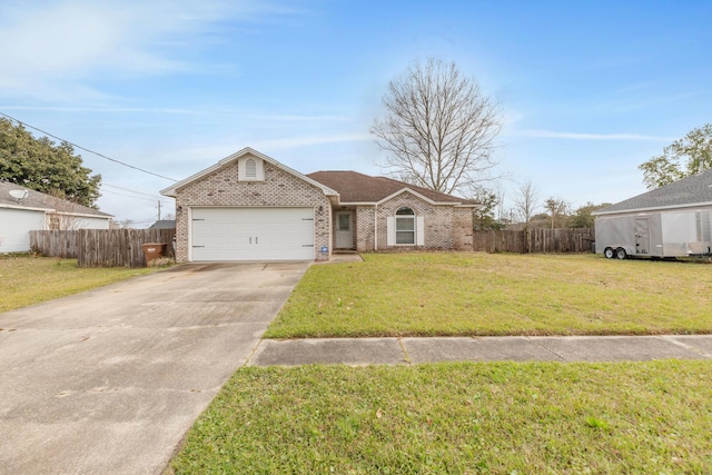 view of front of property with brick siding, driveway, a front lawn, and fence