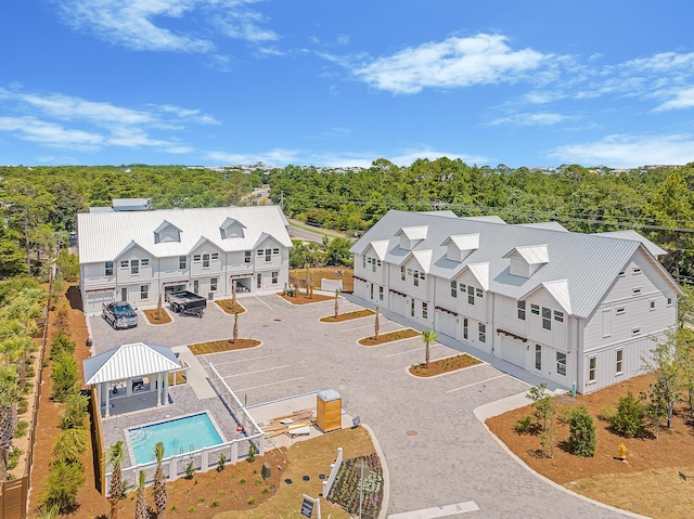 bird's eye view featuring a wooded view