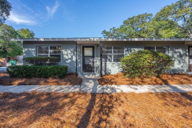 view of front facade featuring concrete block siding