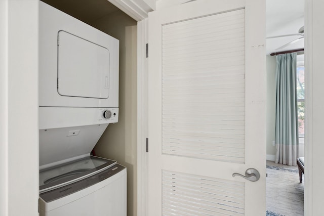 laundry room with laundry area and stacked washer and dryer