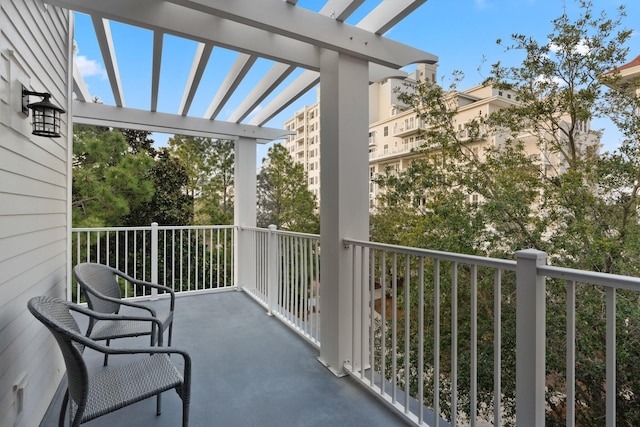 balcony featuring a pergola