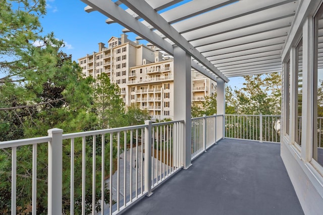 balcony featuring a pergola