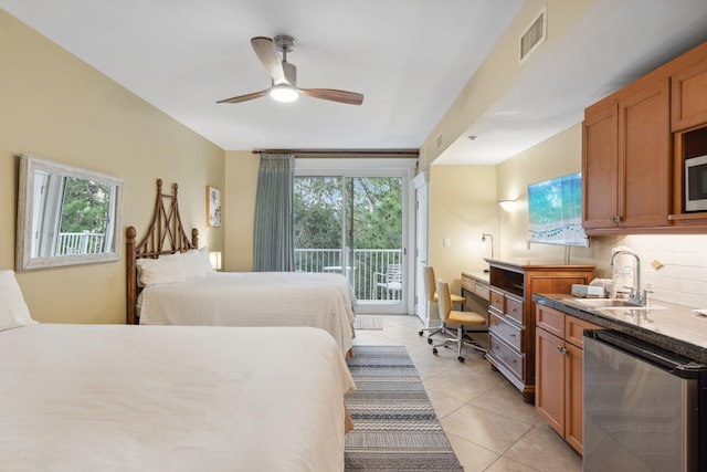 bedroom featuring visible vents, a sink, ceiling fan, light tile patterned floors, and access to exterior