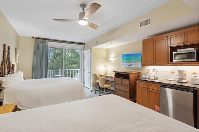 bedroom featuring a ceiling fan, visible vents, freestanding refrigerator, a sink, and access to exterior