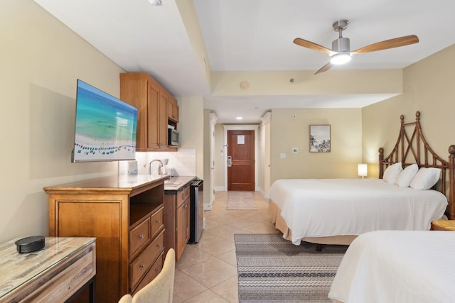 bedroom with a sink, recessed lighting, light tile patterned floors, baseboards, and ceiling fan