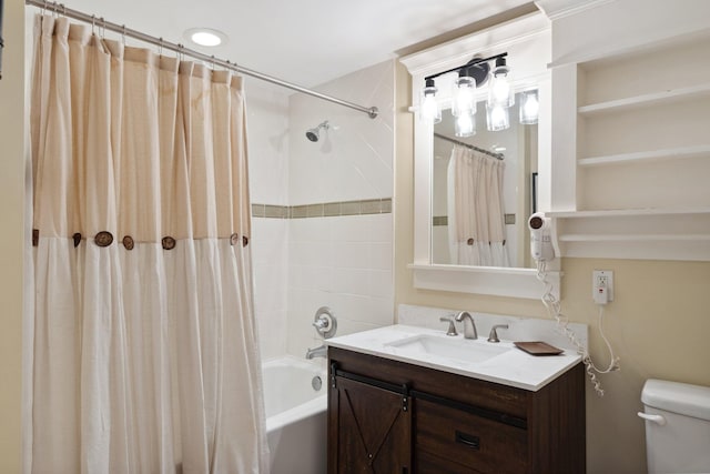 bathroom featuring toilet, vanity, and shower / bath combination with curtain