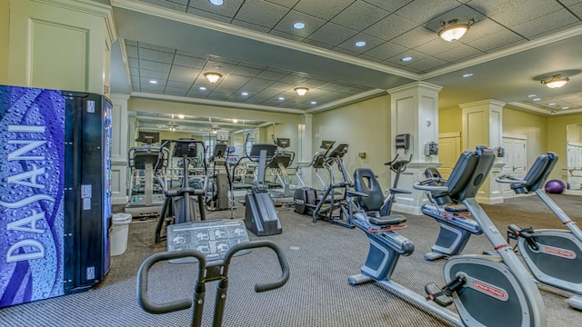 workout area featuring recessed lighting, a decorative wall, ornamental molding, and decorative columns