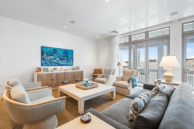 living room featuring recessed lighting and visible vents