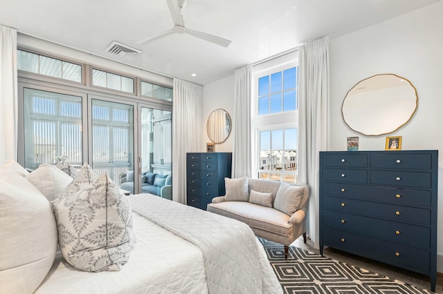 bedroom featuring access to exterior, a ceiling fan, and visible vents