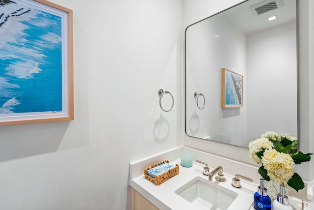 bathroom with visible vents and vanity