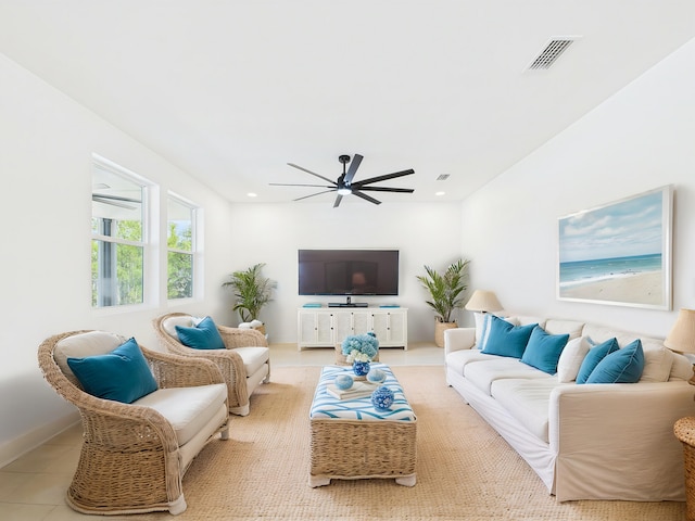 living area featuring light tile patterned floors, recessed lighting, visible vents, ceiling fan, and baseboards