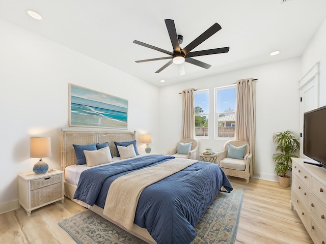 bedroom with a ceiling fan, light wood-type flooring, baseboards, and recessed lighting