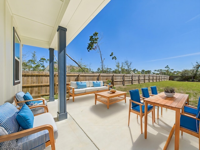 view of patio with outdoor dining area, a fenced backyard, and an outdoor hangout area