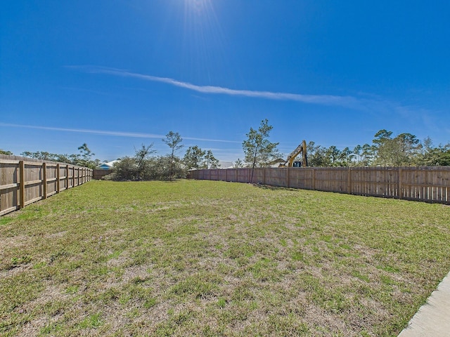 view of yard with a fenced backyard