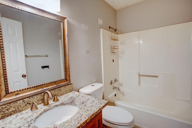 bathroom featuring toilet, vanity, and shower / bathing tub combination