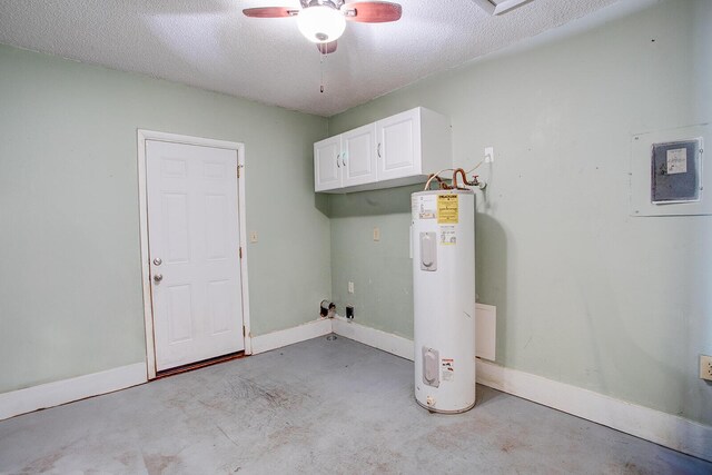 clothes washing area with ceiling fan, a textured ceiling, baseboards, water heater, and cabinet space