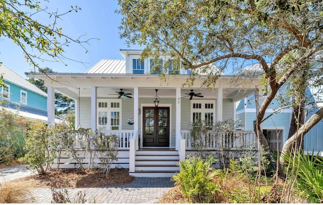 bungalow-style house featuring covered porch, french doors, metal roof, and ceiling fan