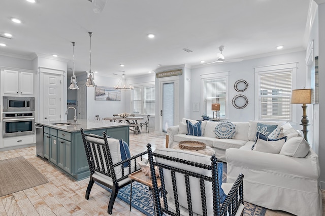 living room featuring ornamental molding, recessed lighting, visible vents, and plenty of natural light