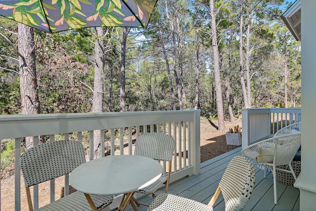 wooden deck with outdoor dining area