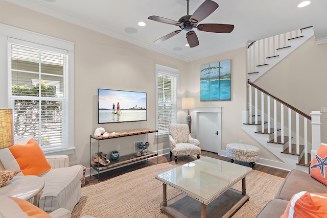 living area featuring stairway, recessed lighting, wood finished floors, and crown molding