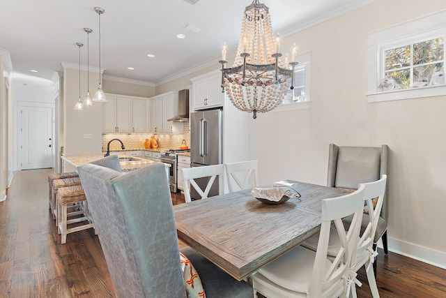 dining room with crown molding, dark wood finished floors, recessed lighting, an inviting chandelier, and baseboards