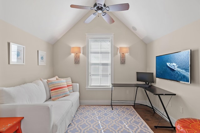 office area featuring a ceiling fan, vaulted ceiling, baseboards, and wood finished floors