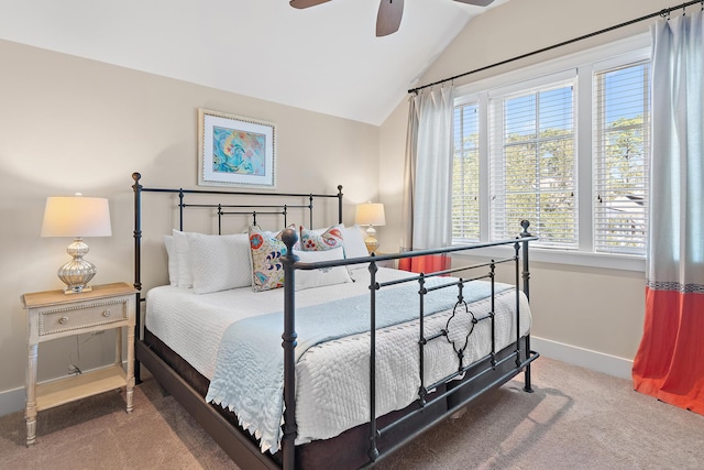 carpeted bedroom featuring a ceiling fan, lofted ceiling, and baseboards