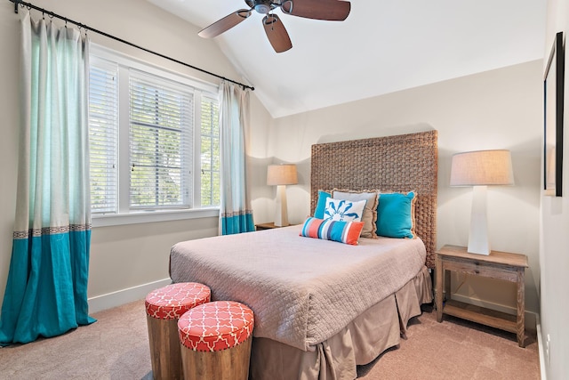 carpeted bedroom featuring vaulted ceiling, ceiling fan, and baseboards