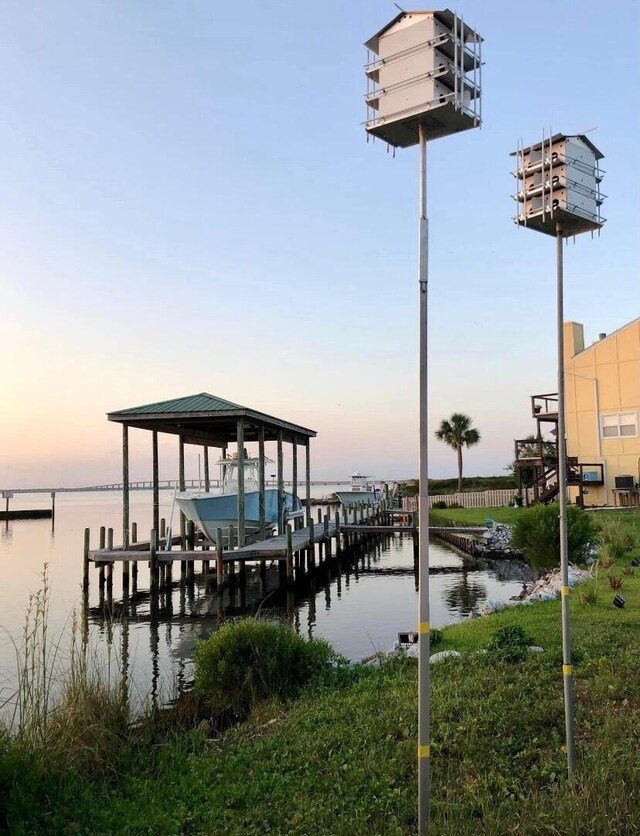 view of dock featuring a water view and boat lift