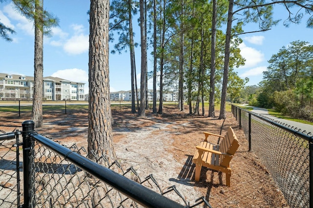 view of yard featuring a residential view and fence