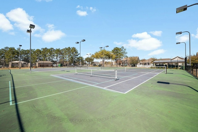 view of sport court with fence