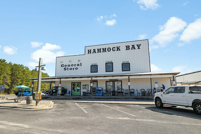 view of building exterior featuring uncovered parking