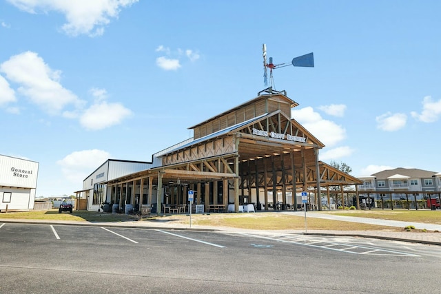 view of building exterior featuring uncovered parking