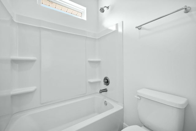 full bathroom featuring shower / tub combination and toilet