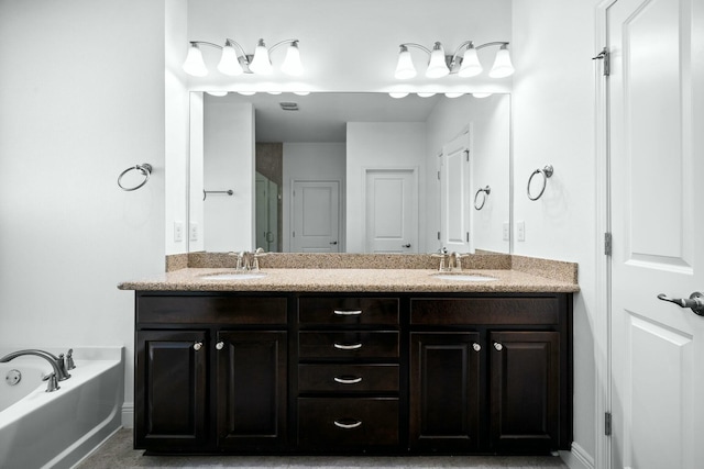 bathroom with double vanity, a bath, a shower stall, and a sink