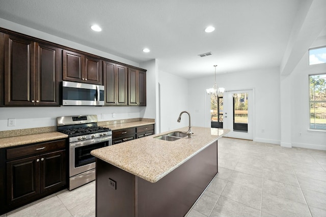 kitchen with visible vents, pendant lighting, a sink, recessed lighting, and appliances with stainless steel finishes