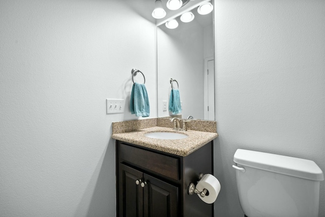 half bath with toilet and vanity